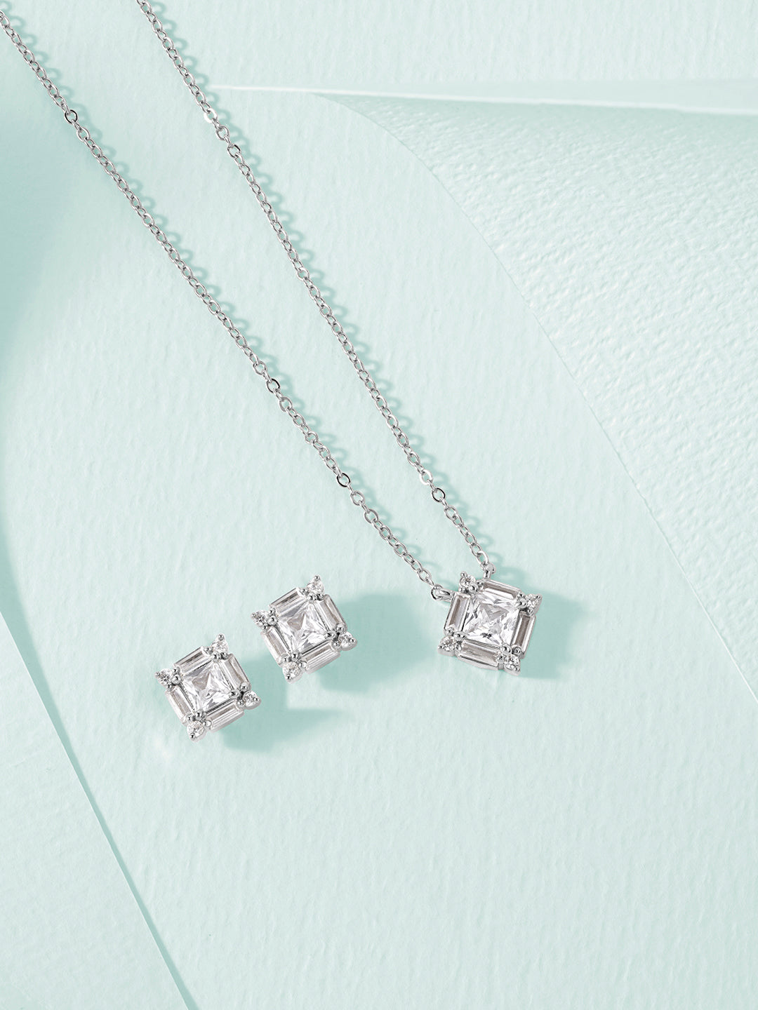 MINUTIAE  Gold_Plated White Crystals Studded pendant and a pair of earrings Jewellery Set